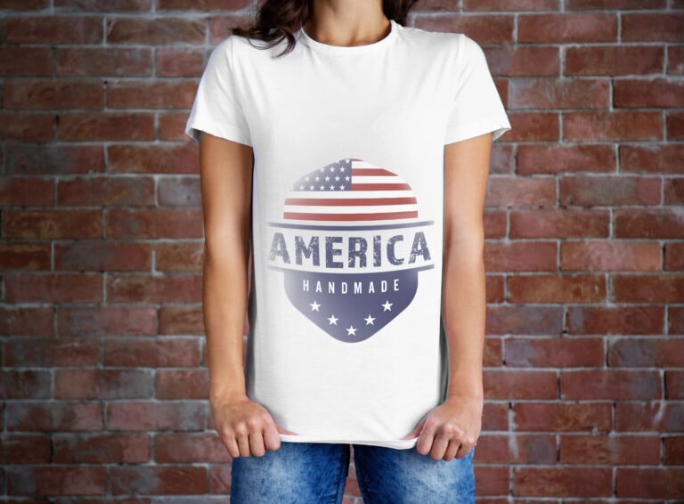 Women's white T-shirt featuring a patriotic American flag design with the word "America" and stars, perfect for celebrating Independence Day and America's 250th anniversary.