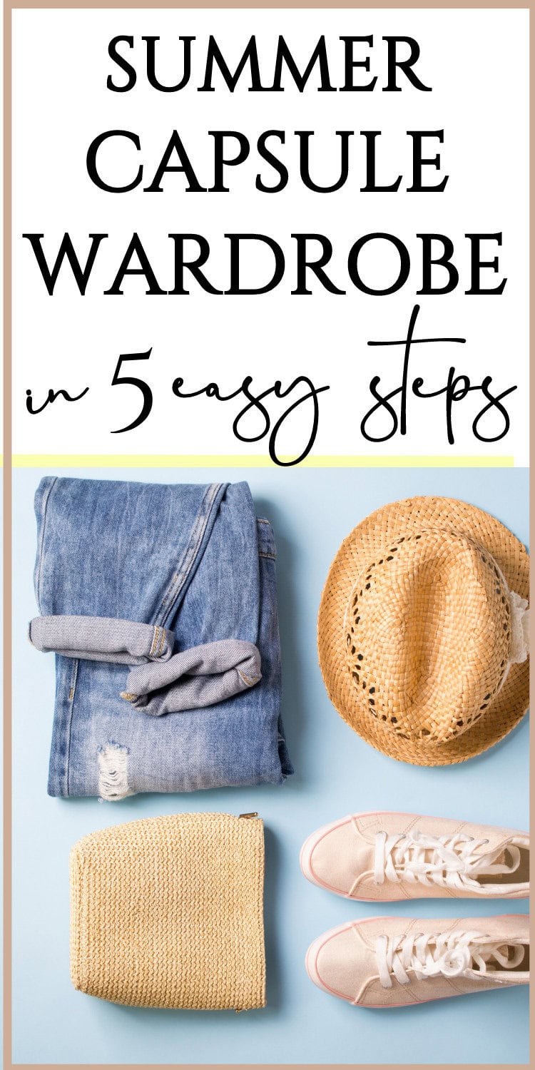 Soft denim jeans with a rolled cuff and gray socks, a natural straw hat with decorative cutouts, a beige knit sweater, and light pink sneakers arranged on a pastel blue background, showcasing summer capsule wardrobe essentials for effortless style.