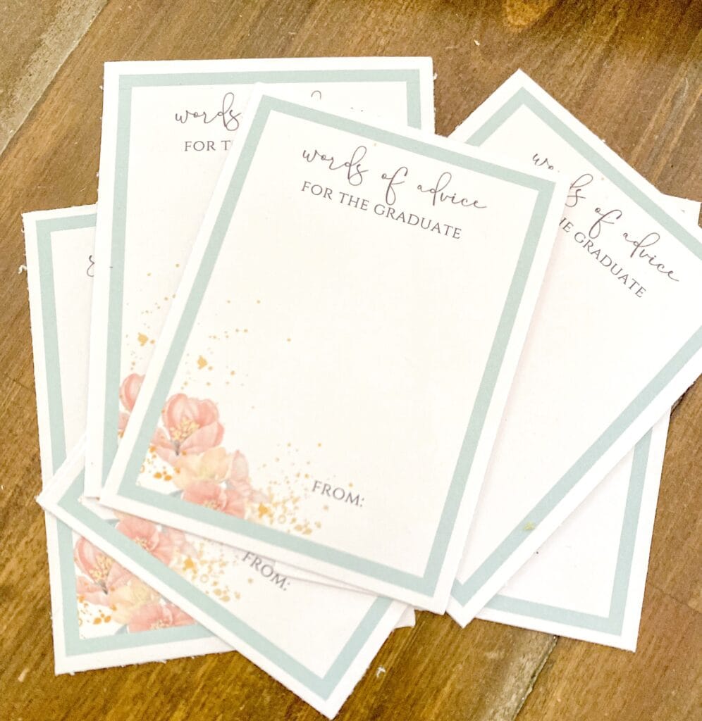 Delicate graduate advice cards with soft pastel floral design, perfect for wedding or graduation celebrations, featuring elegant script text, ideal for personalized messages and keepsakes.