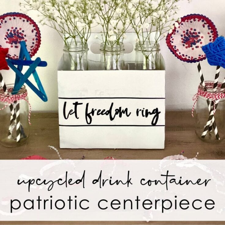 Upcycled drink container patriotic centerpiece with mason jars and floral accents for Independence Day celebrations.