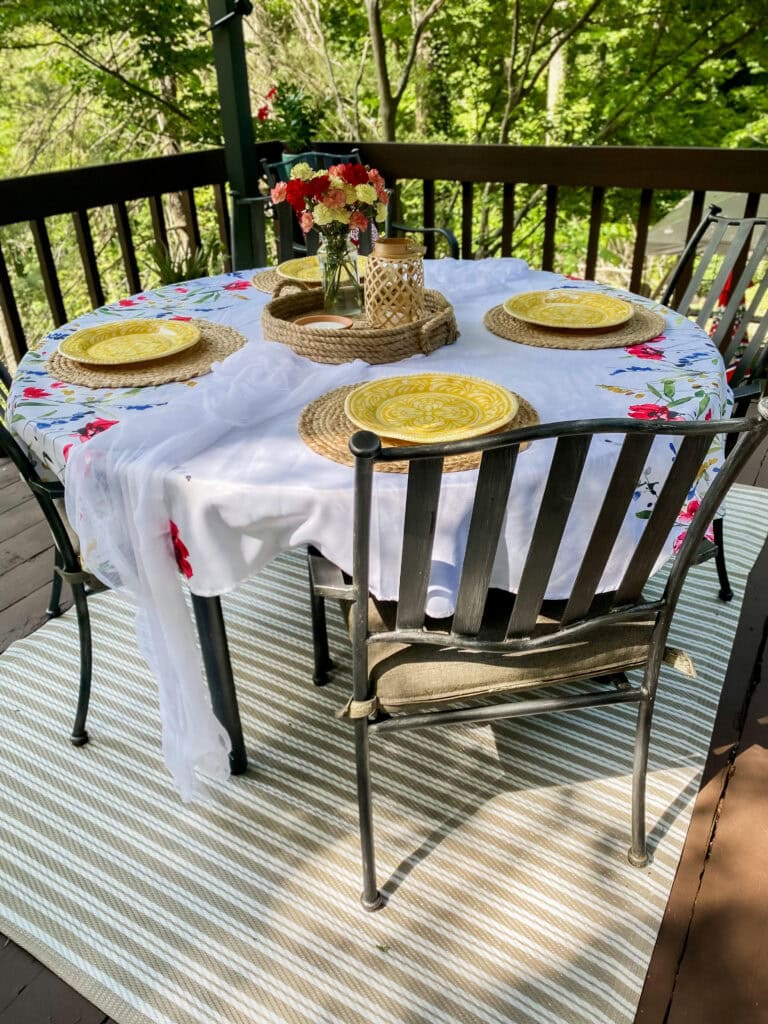 decorated deck with dining table