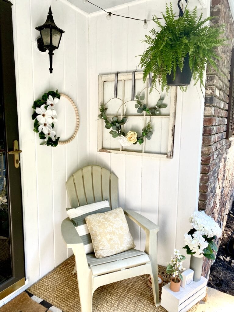 Cozy living room with neutral tones, wooden accents, and greenery, showcasing stylish wall decor and a comfortable beige sofa. Perfect for creating a warm, inviting home atmosphere.