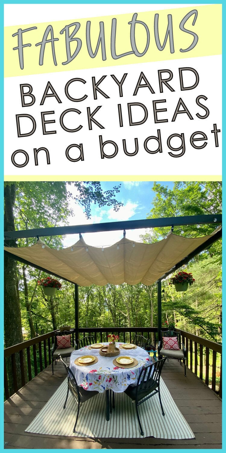 Charming outdoor backyard deck with a round table set for dining, surrounded by lush green trees, decorated with floral tablecloth and string lights for cozy gatherings.