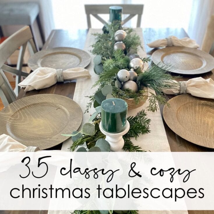 Festive holiday dining table decorated with greenery, silver ornaments, candles, and elegant tableware for Christmas celebration, showcasing cozy and classy Christmas tablescape ideas.