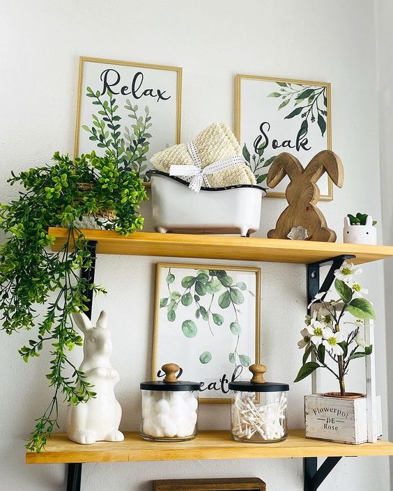 farmhouse style bathroom shelves with green botanical signs, canisters and decor