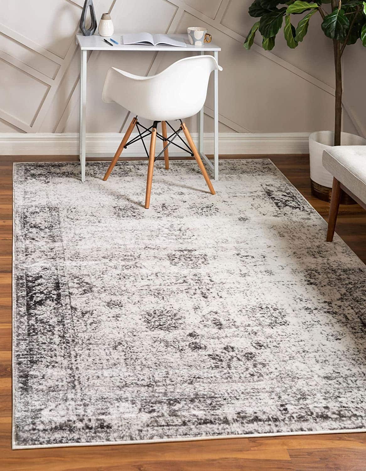 Elegant vintage-style area rug with distressed gray and cream pattern, perfect for modern and traditional living room decor.