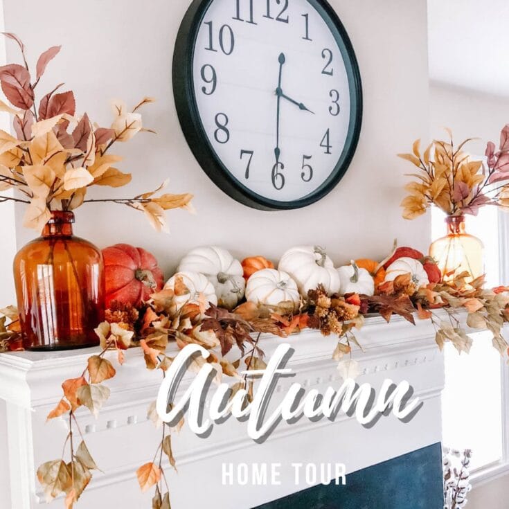 Pumpkin and autumn leaf decor on a mantel with a clock, showcasing fall home decorating ideas for an autumn-themed home tour at A Hundred Affections.