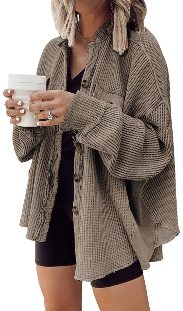 Cozy oversized beige waffle-knit cardigan layered with black shorts and a black top, perfect for fall or casual wear.