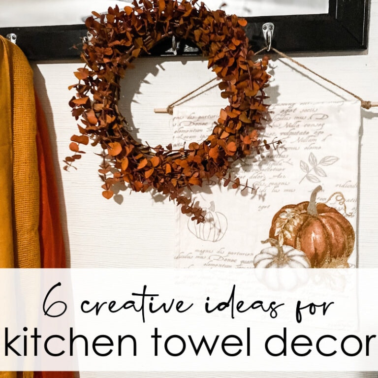 Autumn-inspired wreath with dried leaves hanging in kitchen decor.