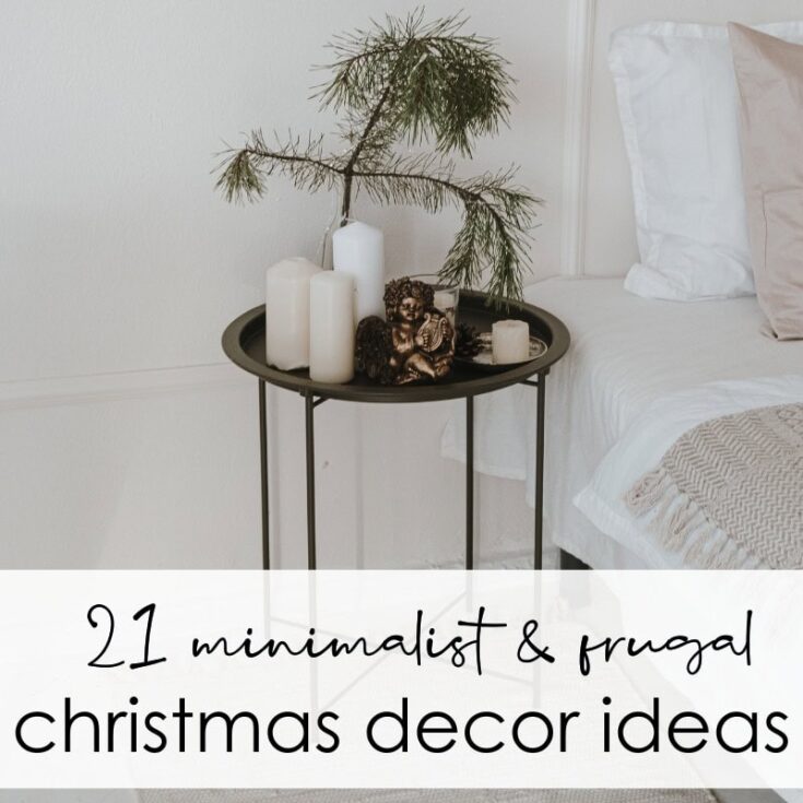 Vase with candles and greenery on round black side table next to bed, minimalist Christmas decor, cozy bedroom holiday decoration, elegant winter home styling, festive yet simple interior design.