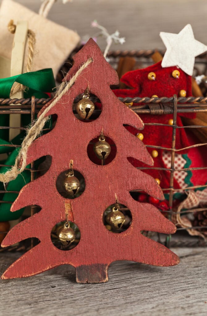 Vintage wooden holiday tree ornament with jingle bells, decorated for Christmas, festive seasonal decor, rustic holiday decoration, A Hundred Affections.