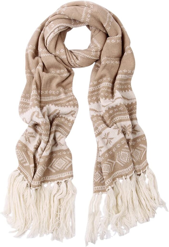 Cozy beige and white knit scarf with tassel fringe, perfect for winter warmth and style, featuring snowflake and geometric patterns, ideal for holiday fashion, from A Hundred Affections.