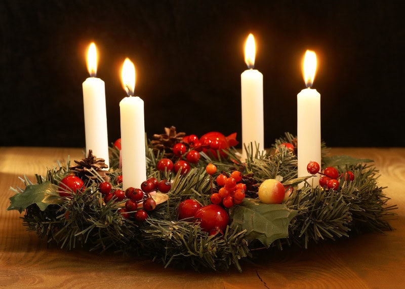foam wreath form decorated with candles for advent