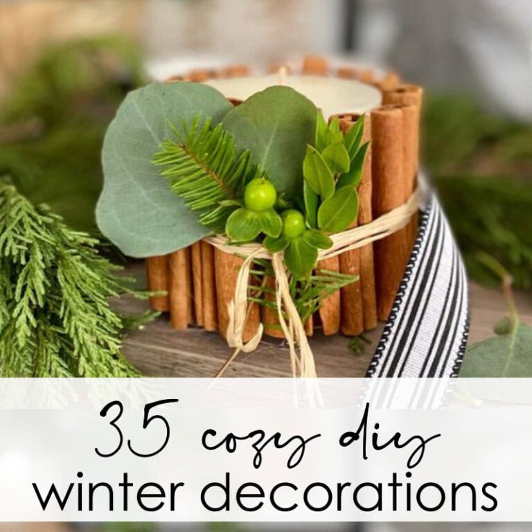 Rustic cinnamon stick candle holder with greenery and natural elements for cozy winter decor, perfect for DIY holiday home accents.