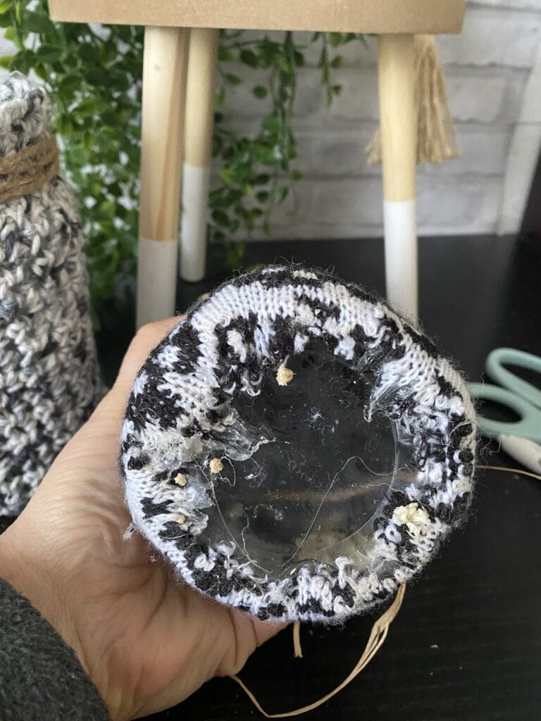 bottom of jar with sweater glued to it
