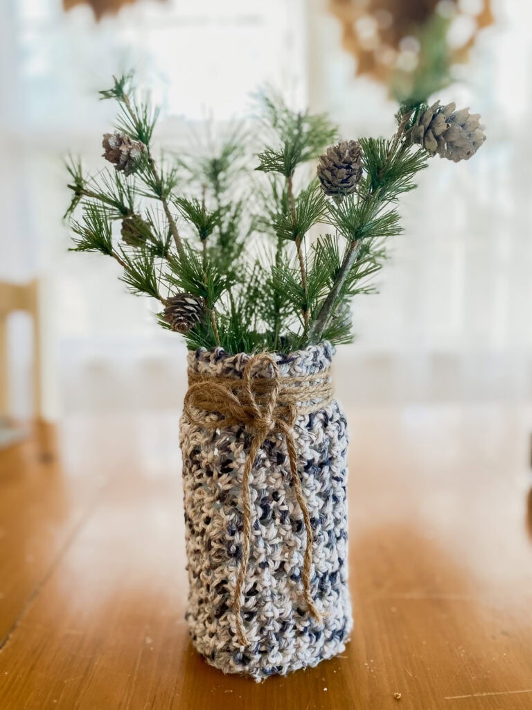 pine greens in jar with crochet cover