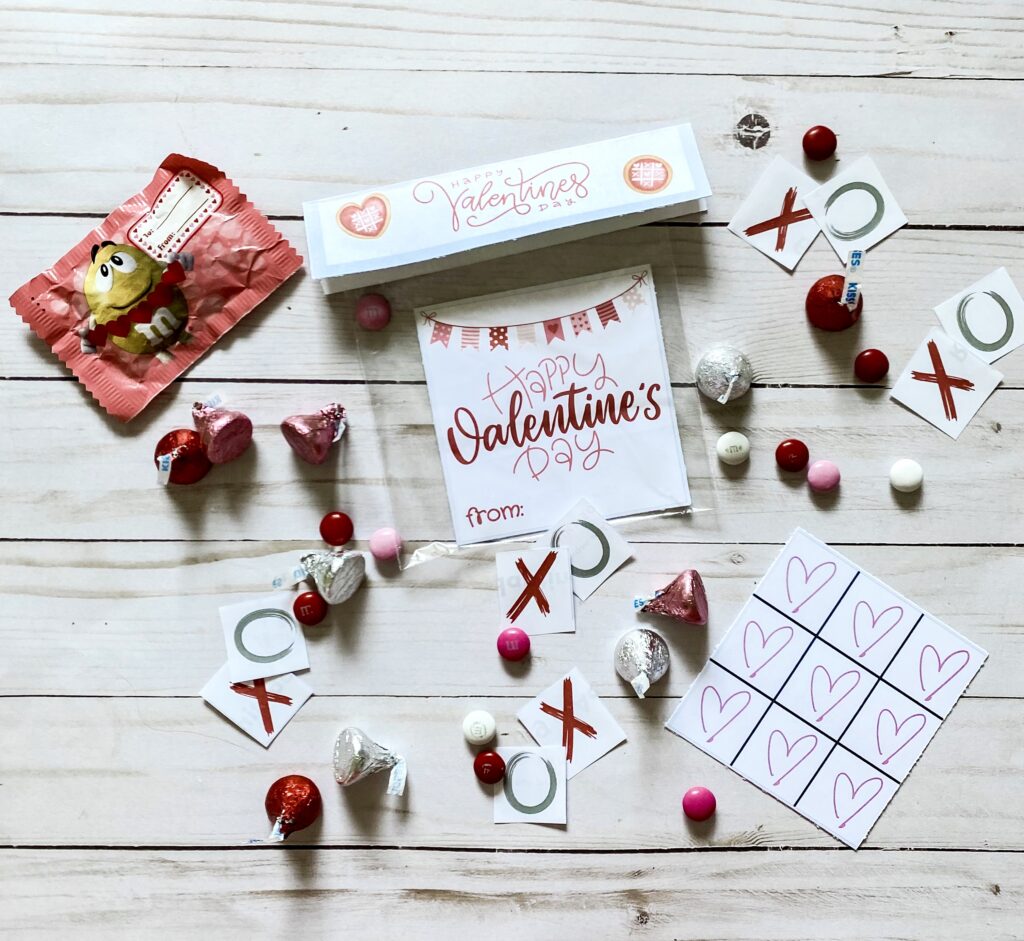 Valentine's Day bundle with card, tic tac toe game board, XO pieces, hershey kisses, and M&Ms