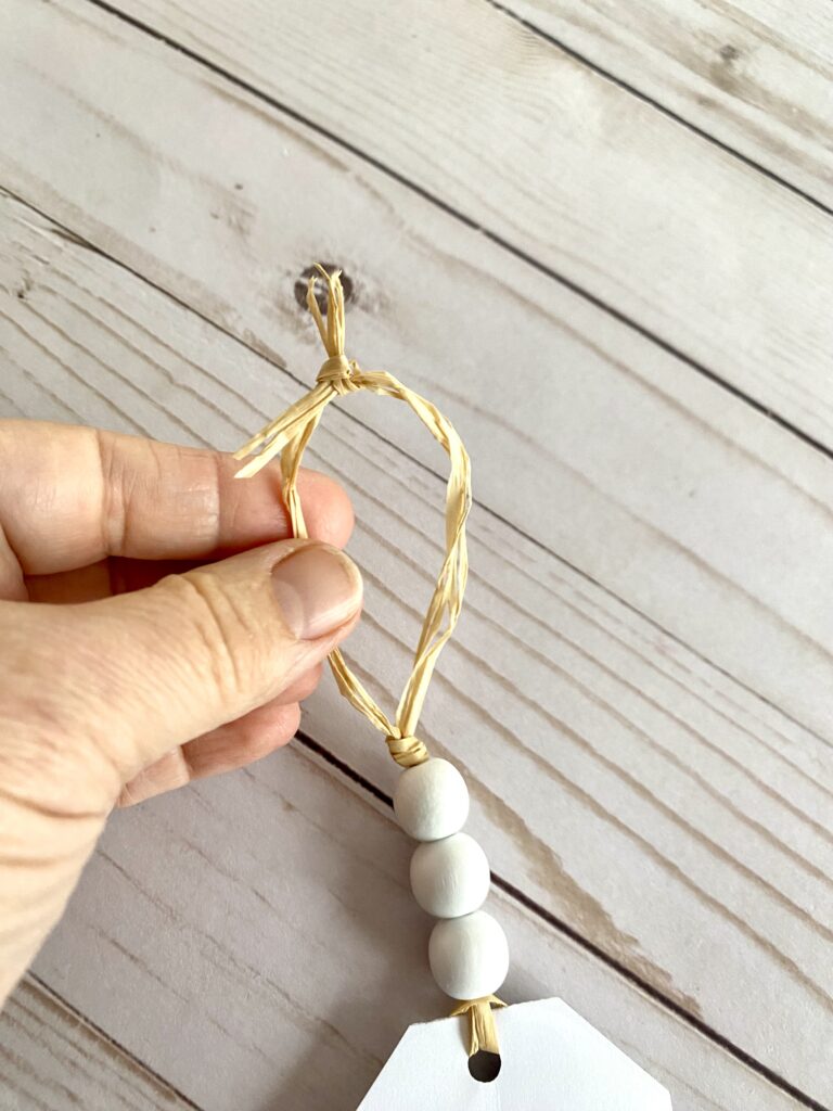 top knot on tag to hang from hook