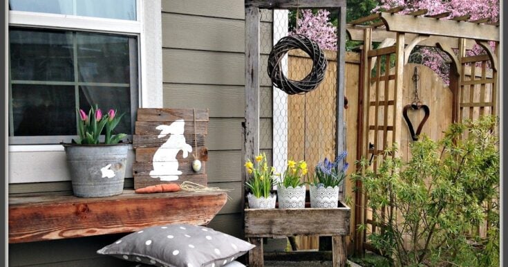 Pink tulips in a rustic metal pot on a wooden shelf, springtime garden decor with bunny silhouette art, colorful daffodils and bluebells in lace-trimmed pots, cozy outdoor space with greenery and wooden fence, perfect for spring gardening and outdoor relaxation.
