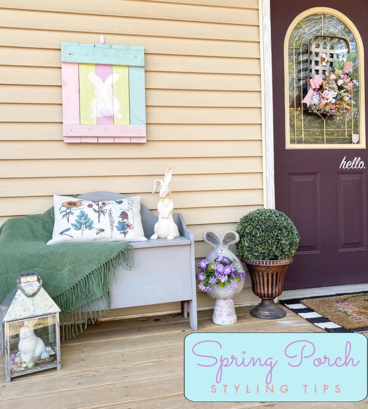 A colorful Easter bunny wall hanging with pastel wood frame, charming spring porch decor with bunny figurines, floral arrangements, and cozy seating for spring decorating inspiration.