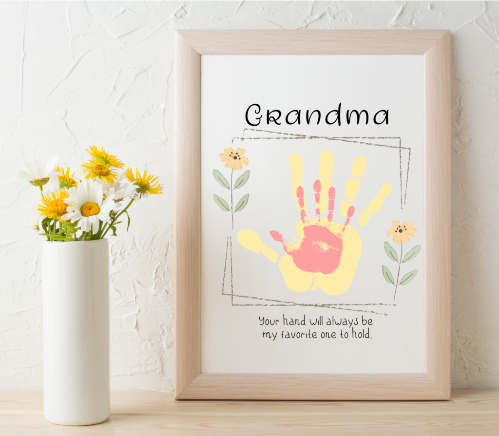 grandma handprint gift in frame with vase of daisies