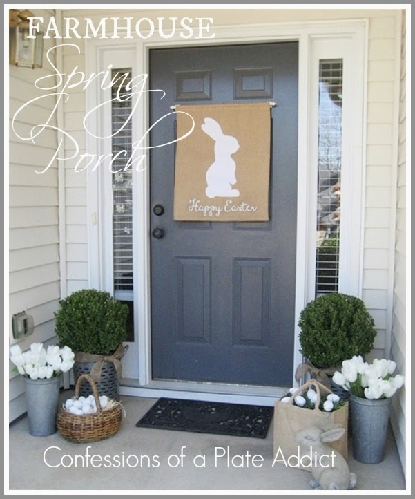 Easter farmhouse spring porch decor with bunny and floral accents for a charming spring home entryway.