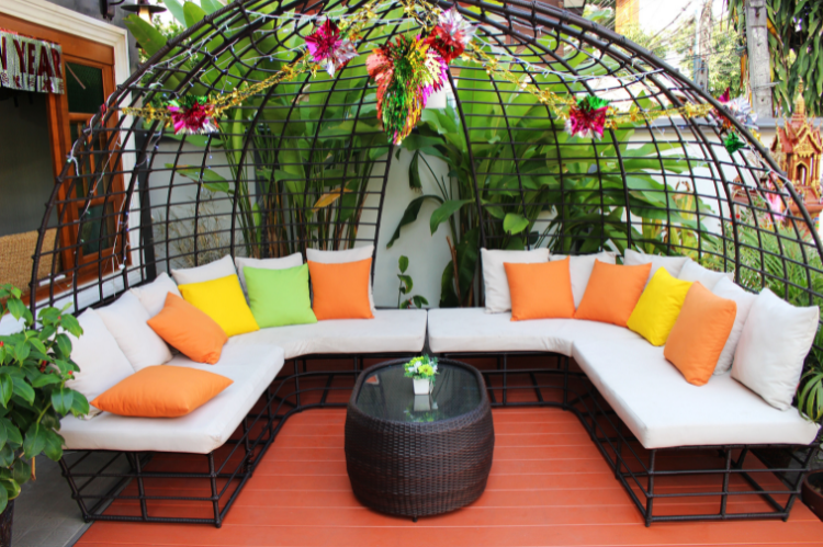 outdoor sectional with bright citrus colored pillows