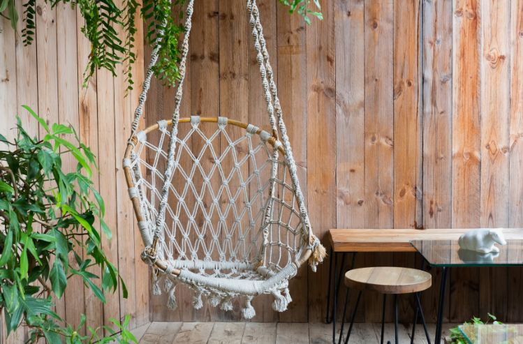 hanging swing chair with privacy fence on patio