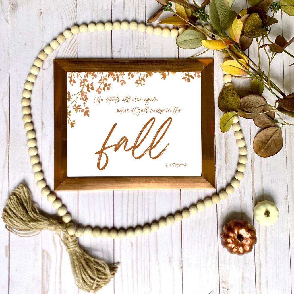 Soft fall decor with dried pampas grass in a black vase, pumpkins, and a framed quote, perfect for autumn home decor and seasonal styling.