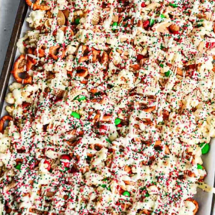 Festive holiday shrimp dip with creamy cheese, colorful sprinkles, and chopped vegetables, perfect for Christmas parties and gatherings.
