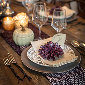 Delicate autumn table setting featuring pumpkins and elegant glassware for a seasonal celebration, styled by A Hundred Affections.