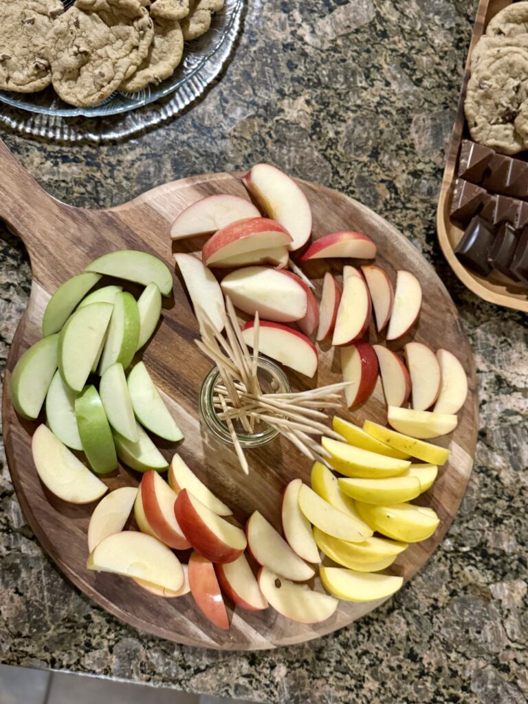 color variety of apples sliced on board