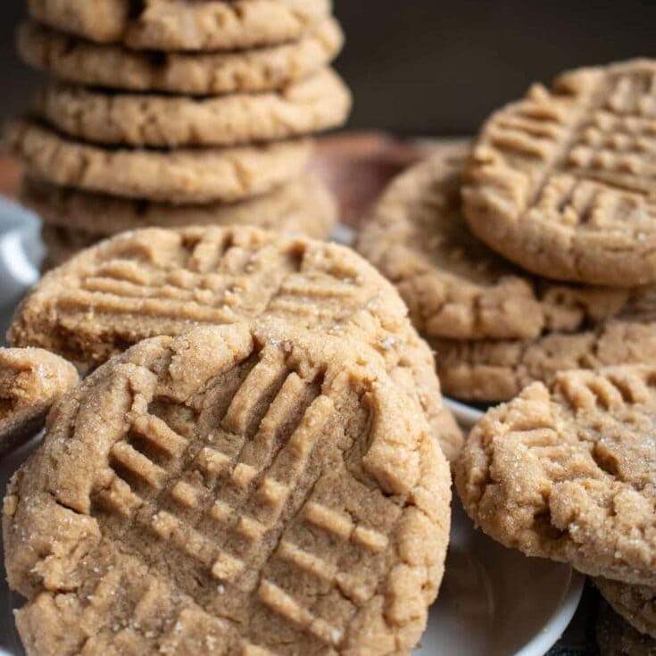 Butterscotch cookies on a white plate with a dark background, close-up image of homemade soft cookies, irresistible treat for cookies lovers, baked cookie recipe from A Hundred Affections.
