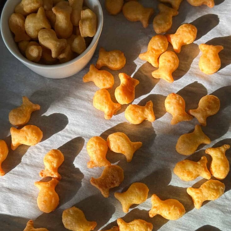 Crispy gold cheddar cheese puffs, snack treats, crunchy snack food, cheesy savory bites, light and airy cheese snacks, perfect for parties and snacking, handmade gourmet cheese puffs, indulgent cheese flavor, crispy texture, fun and addictive snack, popular appetizer, savory cheese bites, cheese lover's snack, flavorful cheesy snacks, snack platter essentials.
