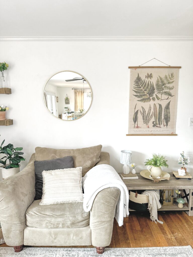 spring wall with modern rustic decor, cozy chair, rustic bench with spring decor