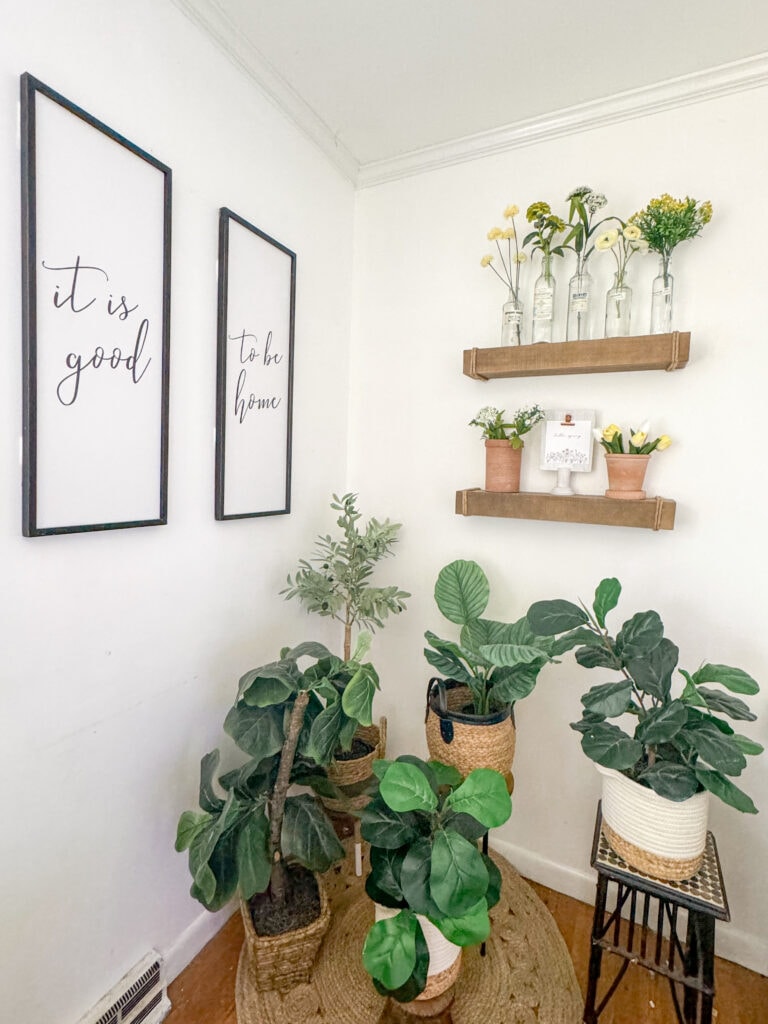 spring corner with faux plants, floating shelves, it is good to be home double sign, modern rustic spring decor