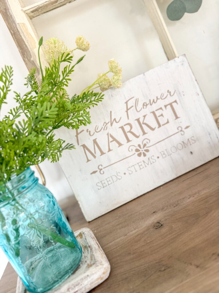 fresh flowers market with blue mason jar and faux flowers