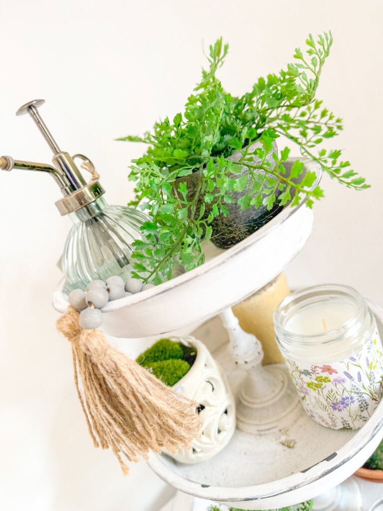 top of spring tiered tray with concrete planter, faux greens, glass plant sprayer