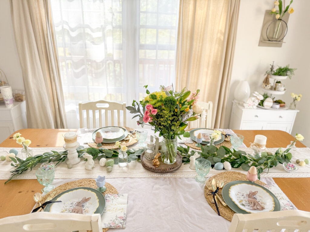 easter tablescape with bunny plates and flower centerpiece