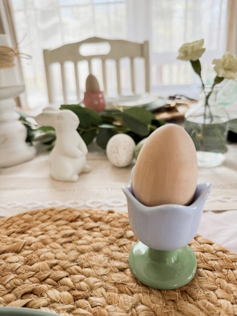 tulip ceramic egg holder with wooden egg on easter table