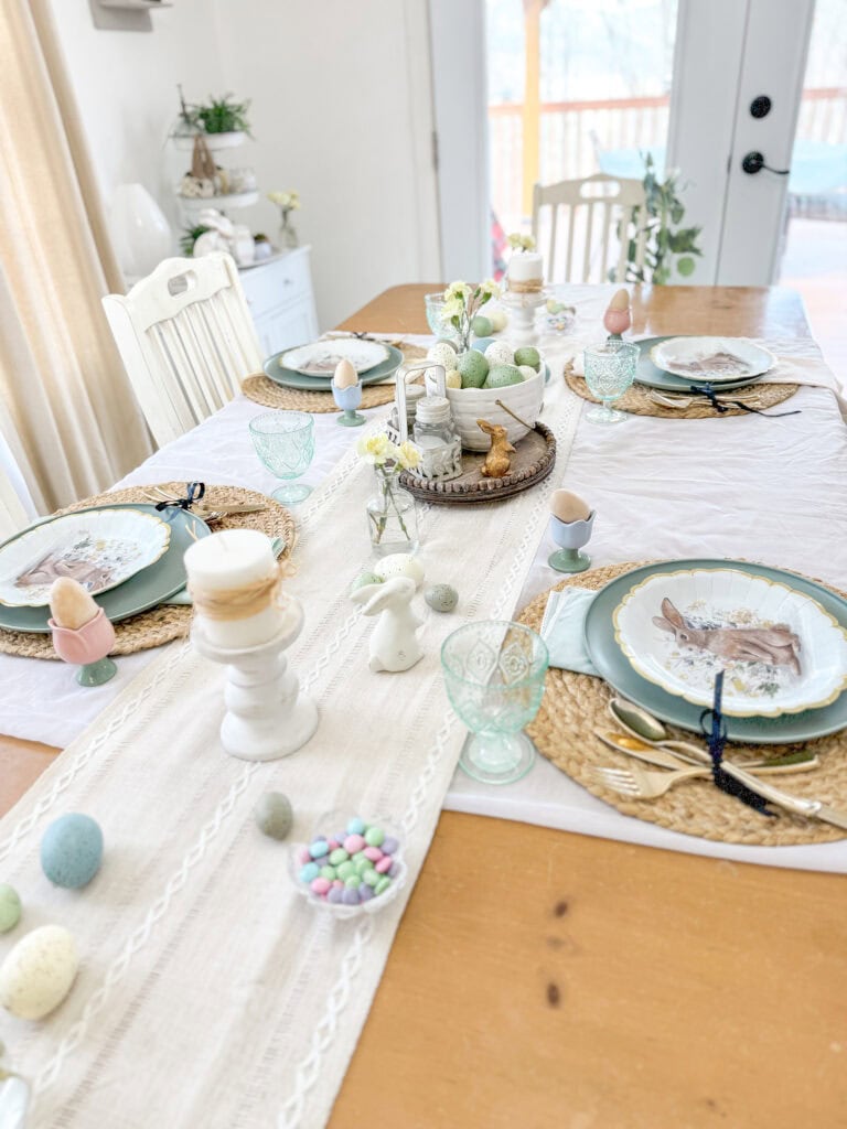 light airy spring tablescape with white sheer cloth and neutral runner, easter decor