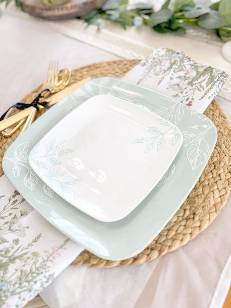 pastel plastic plates for spring table place setting with wildflower linen napkins