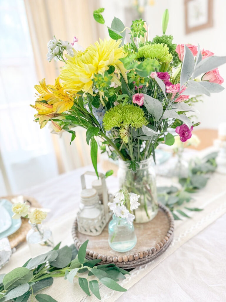 spring fresh flowers floral arrangement centerpiece on spring table