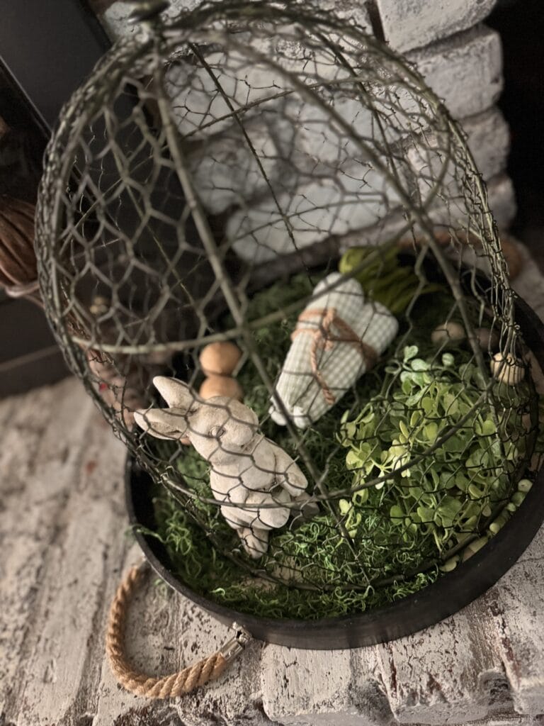 easter vignette in wire cloche with bunny and greens, carrots for cottagecore aesthetic