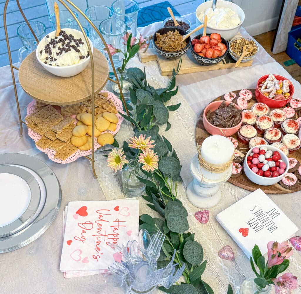 Valentines table with snacks and food for Galentine's Day