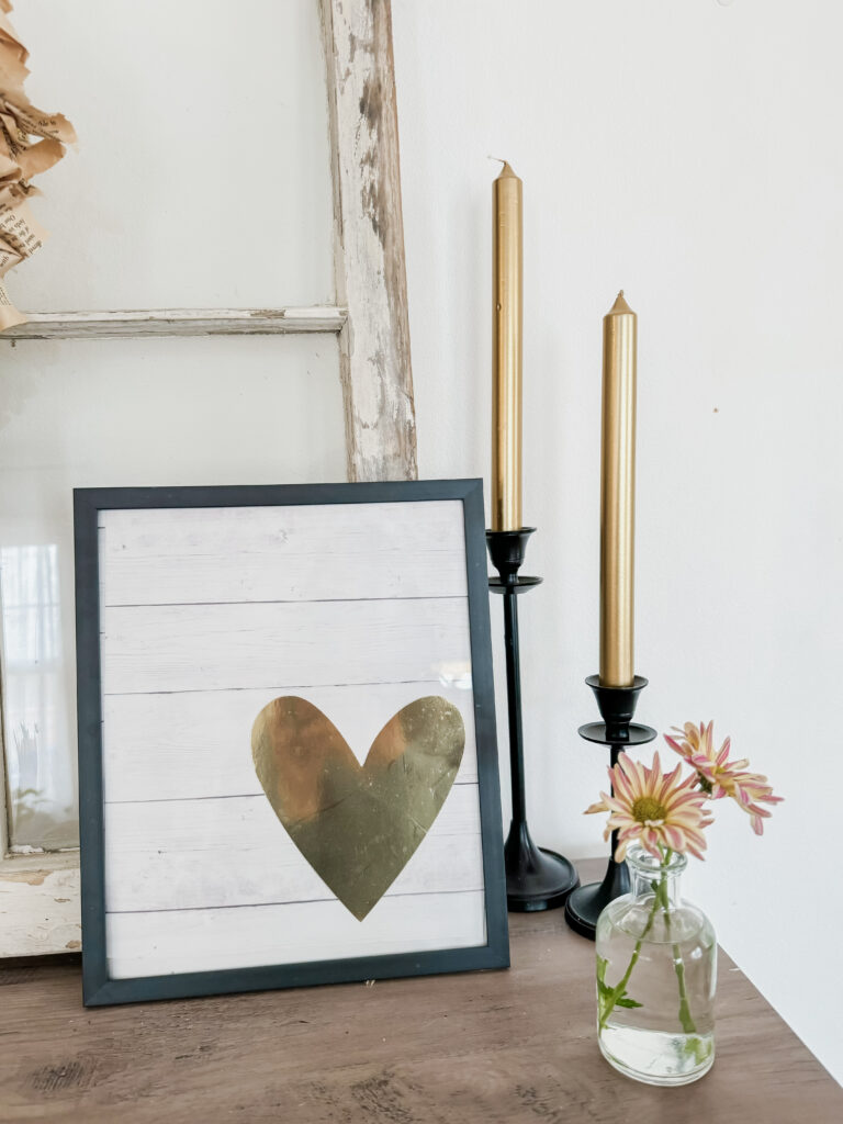 heart sign against rustic window with candles for valentine decor