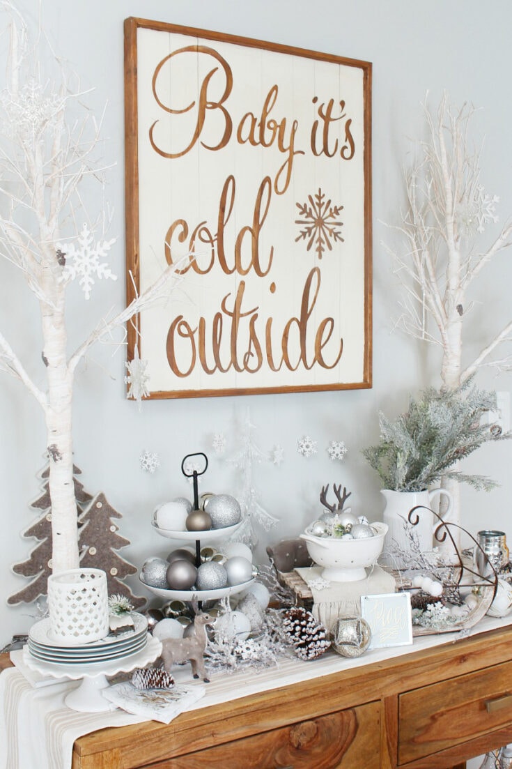 white christmas decor on sideboard buffet with birch tree, tiered tray with ornaments and greens