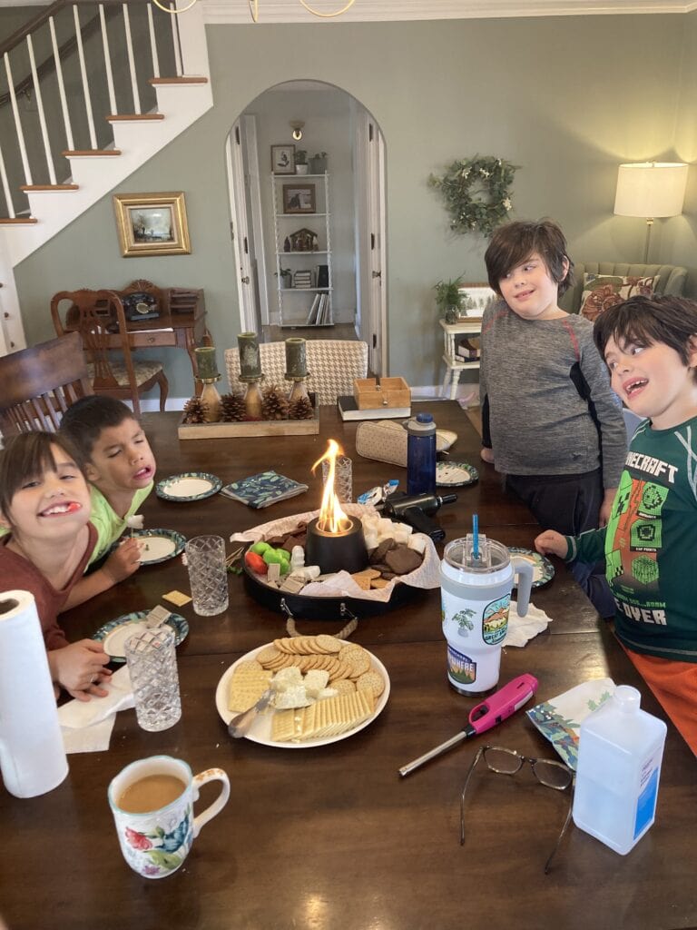 kids gathering with smores christmas board