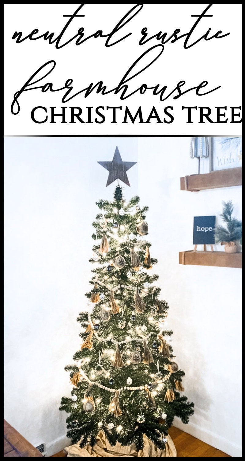 Aesthetic decorated Christmas tree with gold tassels, ornaments, and lights in a cozy farmhouse style.