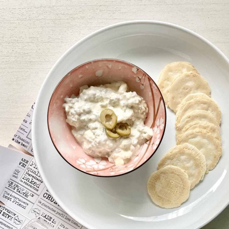 Cream cheese dip with sliced jalapeños served with plantain chips. Fresh, creamy, and flavorful snack perfect for casual gatherings or appetizer menus.